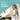 Girl washing the kids cooking utensils at the sink, with the text Love, wash, repeat